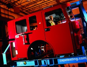 A fire truck cab mid-roll on CAPE's dynamic rollover impact machine.
